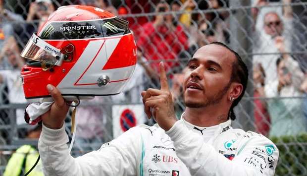 Mercedes' Lewis Hamilton celebrates winning the Monaco Grand Prix after the race