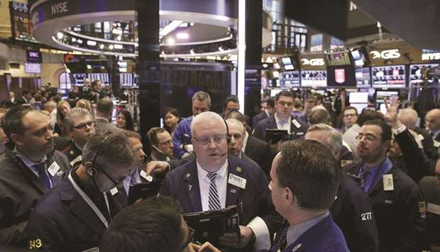 Traders work on the floor of the New York Stock Exchange (file). Some investors are seeking safety in domestic US growth stocks ranging from software and online advertising to aerospace and recruitment since President Donald Trumpu2019s May 5 tweets showed that US talks with China were in trouble.