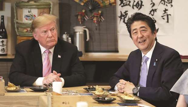 US President Donald Trump talks with Japanese Prime Minister Shinzo Abe during a dinner in Tokyo. Trump acknowledged yesterday a trade deal wouldnu2019t occur during the trip, saying that nothing would be finalised until after Japanu2019s elections in July.