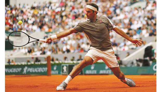 Switzerlandu2019s Roger Federer plays a backhand during his French Open first round match against Italyu2019s Lorenzo Sonego (not pictured) at Roland Garros in Paris yesterday. (Reuters)