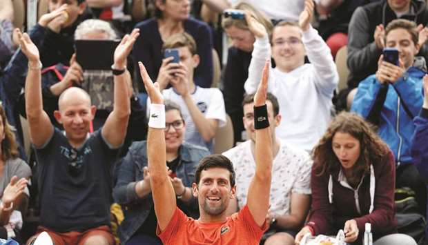 Novak Djokovic acknowledges the crowd during a training session ahead of his French Open campaign in Paris. (Reuters)