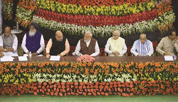 Modi looks on as he listens to Bharatiya Janata Party president Amit Shah speaks during a National Democratic Alliance (NDA) meeting at the Central Hall of the Parliament yesterday. Also seen are Rajnath Singh, Parkash Singh Badal, L K Advani, Murli Manohar Joshi and Uddhav Thackeray.