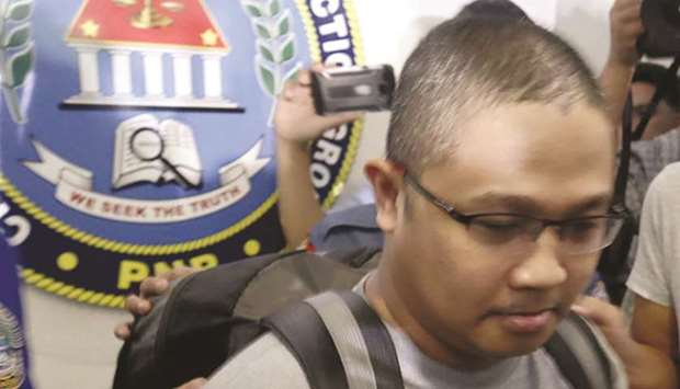 Peter Joemel Advincula leaves Camp Crame, the headquarters of the Philippine National Police.