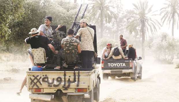Fighters loyal to the Libyan internationally-recognised Government of National Accord (GNA) step up to the front during clashes against forces loyal to strongman Khalifa Haftar, in the Airport Road Area, south of the Libyan capital Tripoli.