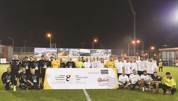 Winners with Ashghal officials and President Saad bin Ahmad al-Muhannadi.