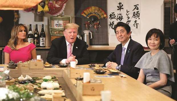 US President Donald Trump and First Lady Melania Trump attend a dinner with Japanu2019s Prime Minister Shinzo Abe and his wife Akie Abe at the Inakaya restaurant in the Roppongi district of Tokyo yesterday.