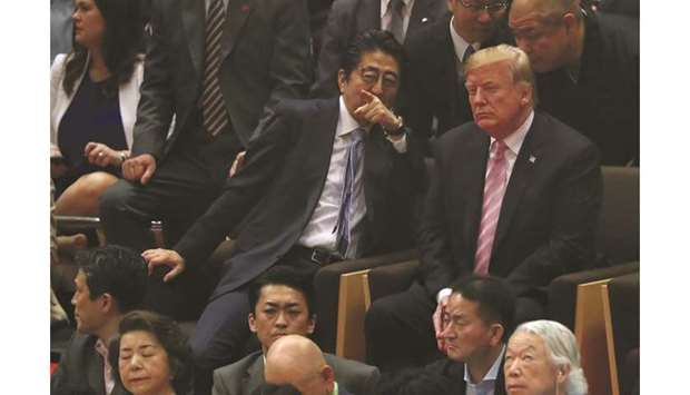 US President Donald Trump and Japanese Prime Minister Shinzo Abe watch the Summer Grand Sumo Tournament at Ryogoku Kokugikan Sumo Hall in Tokyo. Abe said he and Trump had agreed to further accelerate talks, aiming for a swift, win-win result. He reiterated the discussions would be based on a joint statement last September, under which Japan will not be required to offer more access to its farm markets than it has done under existing trade deals.
