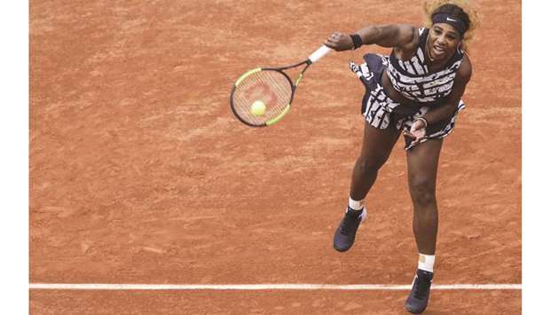 Serena Williams of the US serves the ball to Russiau2019s Vitalia Diatchenko  during their first round match on day two of French Open yesterday.