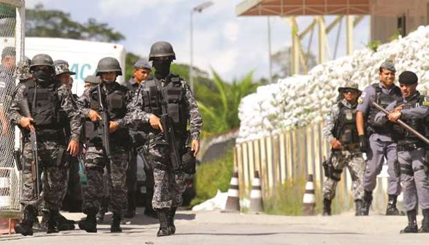 Policemen take position during a riot in a prison in Brazilian state of Amazonas in Manaus.