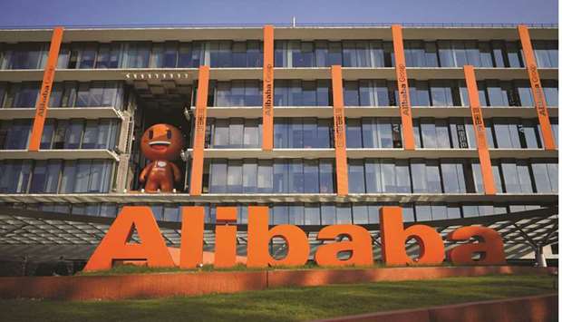 The logo of Alibaba Group is seen at the companyu2019s headquarters in Hangzhou, China. Alibaba is considering raising as much as $20bn through a listing in Hong Kong, lining up a second blockbuster deal following its 2014 record $25bn float in New York.