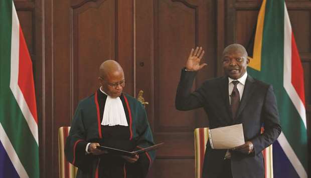 South Africau2019s Deputy President David Mabuza being sworn-in as lawmaker for the ruling African National Congress by Chief Justice Mogoeng Mogoeng in Pretoria.