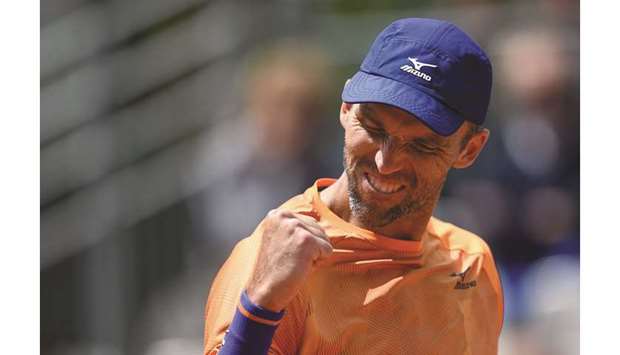 Croatiau2019s Ivo Karlovic reacts during his first round match against Spainu2019s Feliciano Lopez on day three of French Open yesterday.
