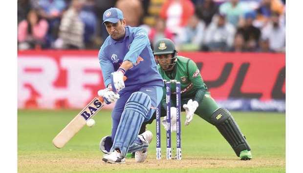 Indiau2019s Mahendra Singh Dhoni in action during the 2019 ICC Cricket World Cup warm-up match against Bangladesh in Cardiff, Wales, yesterday. (AFP)