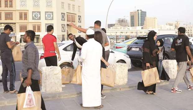 QIC Iftar kits being distributed.