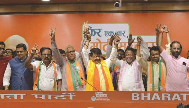 Trinamool Congress and CPM legislators and councillors join the BJP in the presence of party leaders Kailash Vijayvargiya and Mukul Roy in New Delhi yesterday.