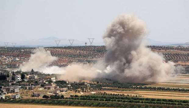 Smoke billows during reported Syrian government forces' bombardments on the village of Sheikh Mustafa in the southern countryside of the jihadist-held Idlib province