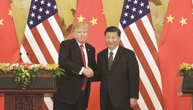 US President Donald Trump (left), and Xi Jinping, Chinau2019s President, shake hands during a news conference at the Great Hall of the People in Beijing (file). The Trump administration again refrained from labelling China a currency manipulator on Tuesday, a decision that leaves one of the presidentu2019s campaign promises unfulfilled but avoids further escalation in the trade war between the worldu2019s two largest economies.