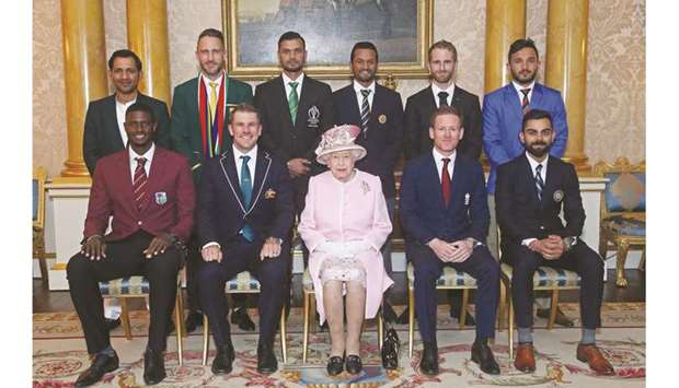 Britainu2019s Queen Elizabeth II (centre) poses with the captains of the cricket teams participating in the ICC Cricket World Cup 2019 at Buckingham Palace in London yesterday. (AFP)