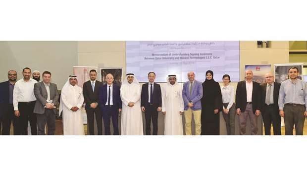 QU and Huawei officials at the MoU signing ceremony yesterday.