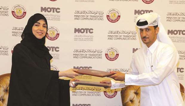 Officials of the transport ministry and Al Ahmadani Medical Centre exchange documents after signing the MoU.