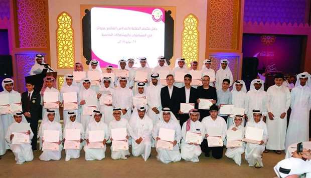 HE the Undersecretary Ibrahim bin Saleh al-Nuaimi with the award winners and teachers at the event. PICTURE: Thajudheen
