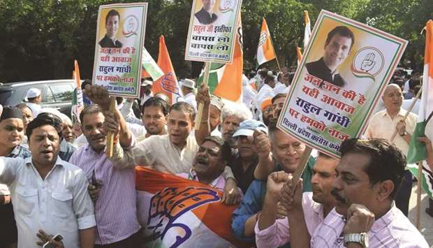 Congress workers assemble outside party president Rahul Gandhiu2019s residence to appeal him to withdraw his offer to step down from the partyu2019s top post, in New Delhi yesterday.