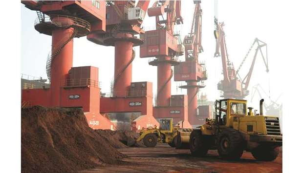 Workers transport soil containing rare earth elements for export at a port in Lianyungang, Jiangsu province, China (file). The threat to weaponise strategic materials ratchets up the tension between the worldu2019s two biggest economies before an expected meeting between Presidents Xi Jinping and Donald Trump at the G-20 meeting next month.