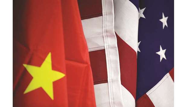 Flags of US and China are displayed at the American International Chamber of Commerce booth during the China International Fair for Trade in Services in Beijing on Tuesday. The US relied on China for about four of every five tonnes of rare-earths imports between 2014 and 2017 and in 2018 purchased $160mn-worth, up 17% from a year earlier.