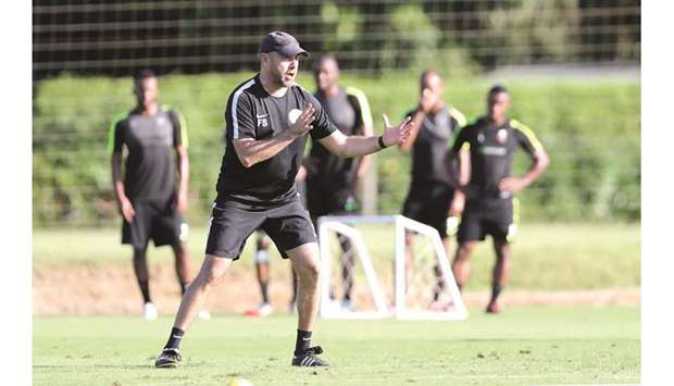 Qatar coach Felix Sanchez is animated during a training session.