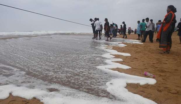 People look out towards the sea from in Puri,Odisha, yesterday as cyclone Fani approaches the Indian coastline.