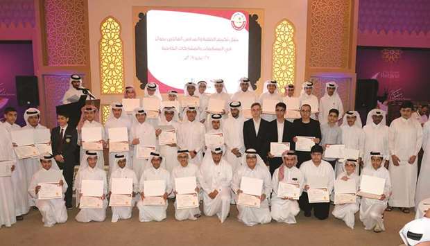 HE the Undersecretary Ibrahim bin Saleh al-Nuaimi with the award winners and teachers at the event. PICTURES: Thajudheen