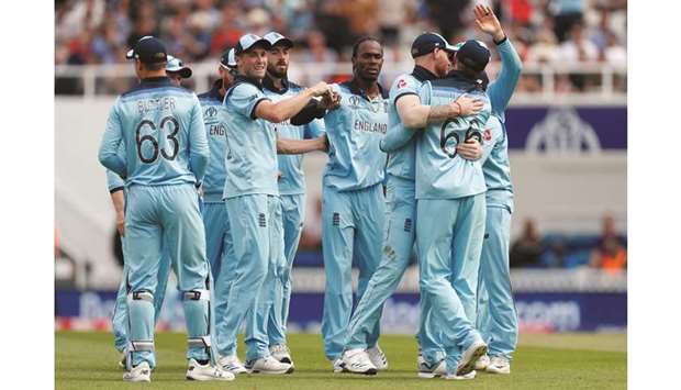 England players celebrate after Jofra Archer (centre) took the wicket of South Africau2019s Aiden Markram (not pictured) during their 2019 ICC Cricket World Cup match in London on Thursday. (Reuters)