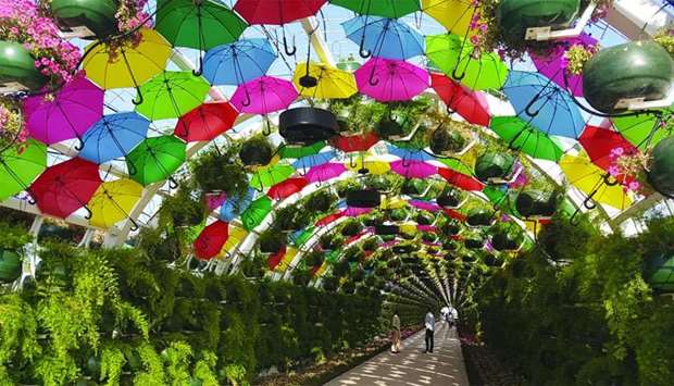 A colourful floral and umbrella arch at the Corniche metro station has become a major attraction along the Doha Metro Red Line South. PICTURE: Joey Aguilar.