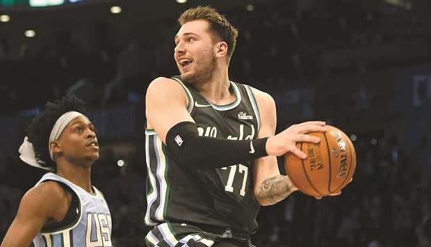 Luka Doncic of the Dallas Mavericks drives past the US Teamu2019s Aaron Fox, of the Sacramento Kings, during the MTN Dew Ice Rising Stars game at Spectrum Center in Charlotte on February 15, 2019. (Charlotte Observer/TNS)