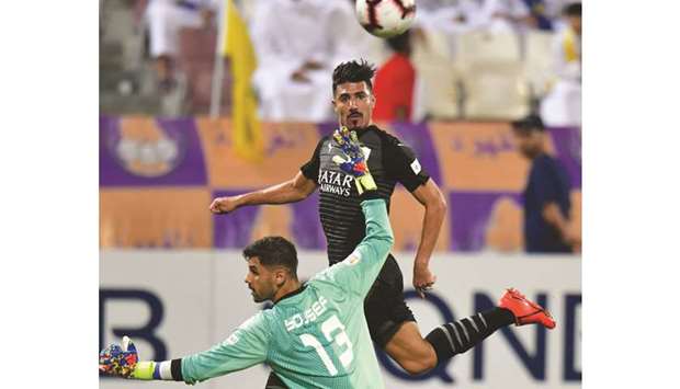 Al Saddu2019s Baghdad Bounedjah scores against Al Gharafa in the Amir Cup quarter-finals at the Abdullah Bin Khalifa Stadium yesterday. PICTURE: Noushad Thekkayil