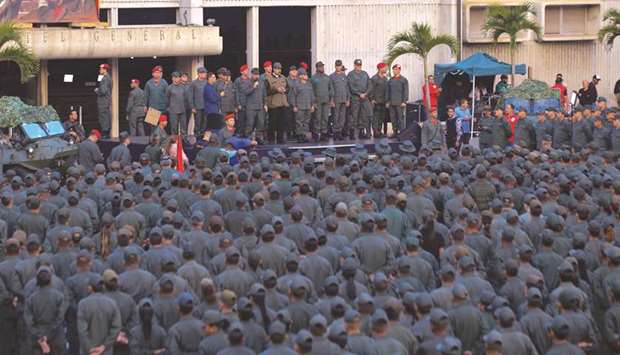 Venezuelau2019s President Nicolas Maduro delivers a message to loyal troops at the u201cFuerte Tiunau201d in Caracas, Venezuela, yesterday.