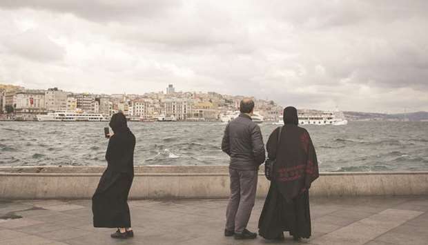 A visitor takes a photograph of the Bosphorus Strait waterway in the Eminonu district of Istanbul (file). Month-on-month consumer price inflation in Turkey was a less-than-expected 1.69%, driven by a 6.77% leap in beverages and tobacco prices in the wake of nationwide local elections at the end of March.