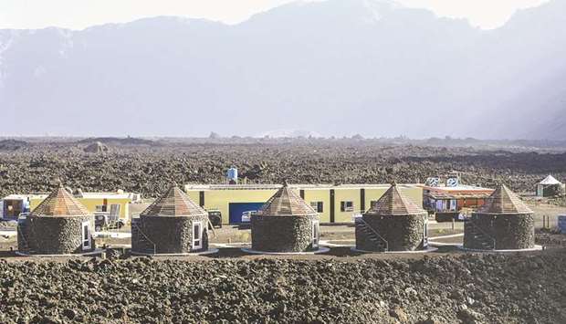 This picture taken on March 30, 2019 shows the newly built Marisau2019s hotel, made with cement and lava on the roof of the owneru2019s former house, in the village of Portelo in Cape Verdeu2019s Cha das Caldeiras valley. Four years and a half later, the village of Portelo was partly rebuilt despite the risk of a new eruption.