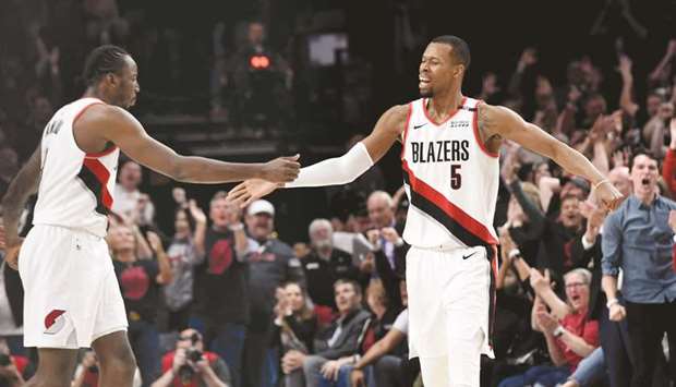 Rodney Hood (right) of the Portland Trail Blazers celebrates with a teammate after his game winning shot during the fourth overtime of game three of the Western Conference semi-finals against the Denver Nuggets at Moda Center in Portland, Oregon. (Getty Images/AFP)