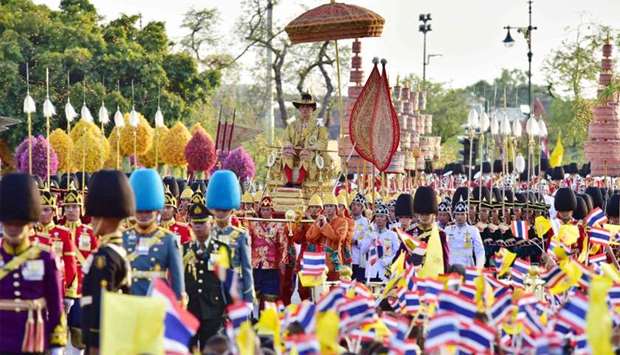 Thailand's King Maha Vajiralongkorn being carried in a palanquin during his coronation procession in Bangkok