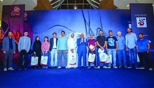 Top winners of u201cCapture Qataru201d photo contest after receiving their awards.rnrn