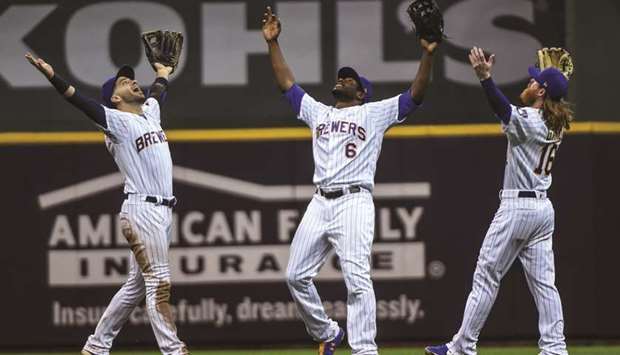 Milwaukee Brewersu2019 Ryan Braun (left) and Lorenzo Cain (centre) and Ben Gamel celebrate after beating the New York Mets in Milwaukee. (USA TODAY Sports)