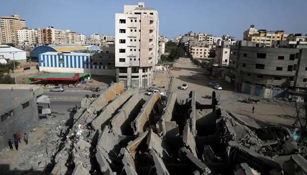 A view shows the remains of a building that was destroyed by Israeli air strikes, in Gaza City