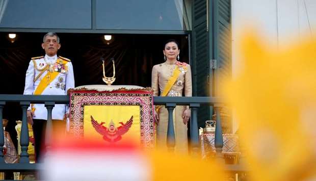 Thailand's newly crowned King Maha Vajiralongkorn and Queen Suthida are seen outside the balcony of Suddhaisavarya Prasad Hall at the Grand Palace where King grants a public audience to receive the good wishes of the people in Bangkok, Thailand