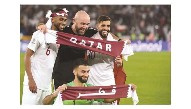 File photo of Felix Sanchez celebrating with Qatari players after their Asian Cup win in February this year.