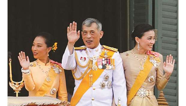 Thailandu2019s newly crowned King Maha Vajiralongkorn, Queen Suthida and Princess Bajrakitiyabha are seen atu00a0the balcony of Suddhaisavarya Prasad Hall at the Grand Palace where King grants a public audience to receive the good wishes of the people in Bangkok, Thailand.