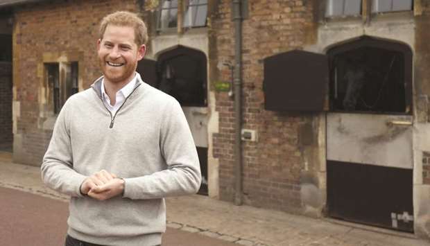 Prince Harry, Duke of Sussex, speaks to members of the media at Windsor Castle in Windsor, west of London, yesterday, following the announcement that his wife, Meghan, Duchess of Sussex, has given birth to a son.