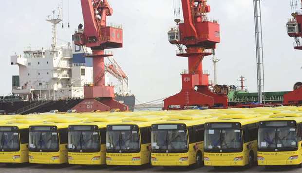 Buses wait to be exported in Lianyungang port. Chinau2019s overall trade surplus is expected to have expanded to $35bn in April from $32.65bn the previous month, according to a Reuters poll.