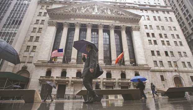 Pedestrians walking past the New York Stock Exchange. Investors werenu2019t happy about Trumpu2019s latest tariff threat, with S&P 500 futures lower by about 50 points.