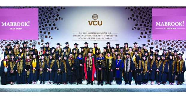 VCUarts Qatar graduates with officials at the ceremony.rnrn
